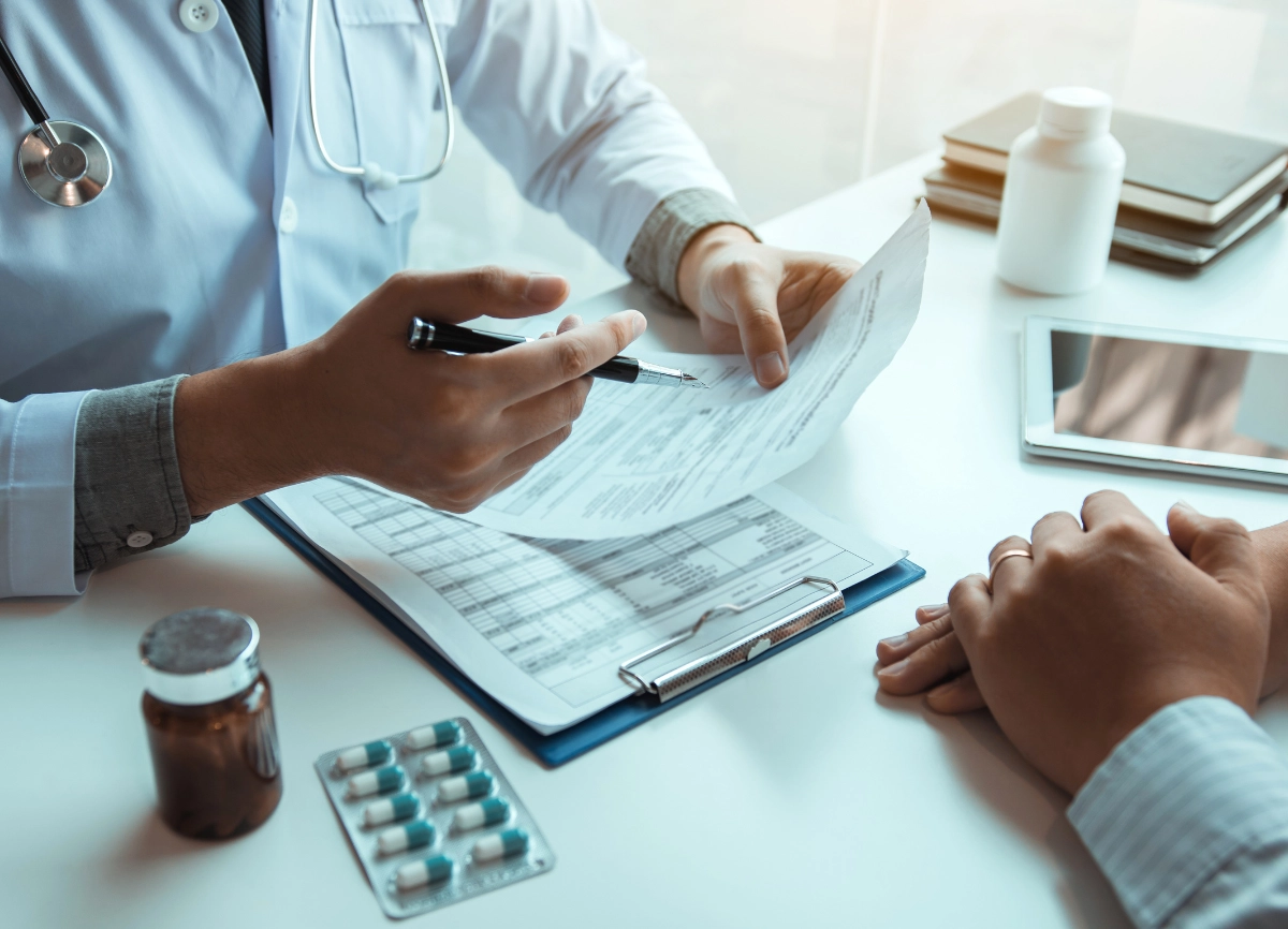 A picture of two people in a medical consultation for hair loss support