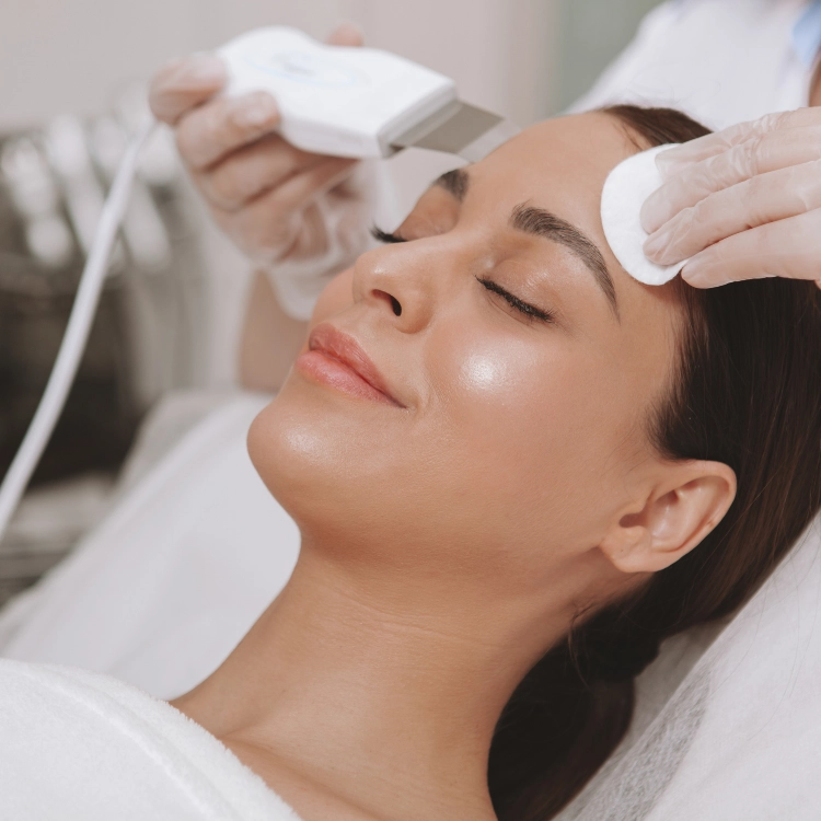 A picture of a woman receiving a vampire facial